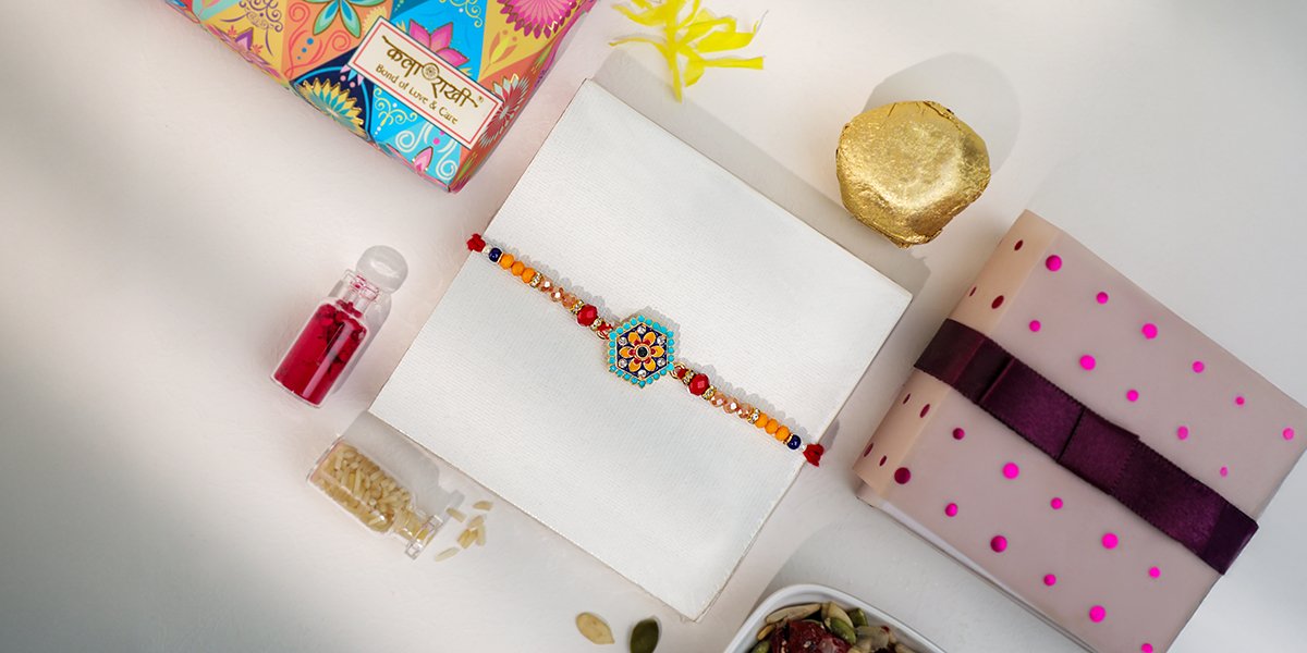 Meenakari Rakhi with multicolor beads and red thread in festive box – Kala Rakhi