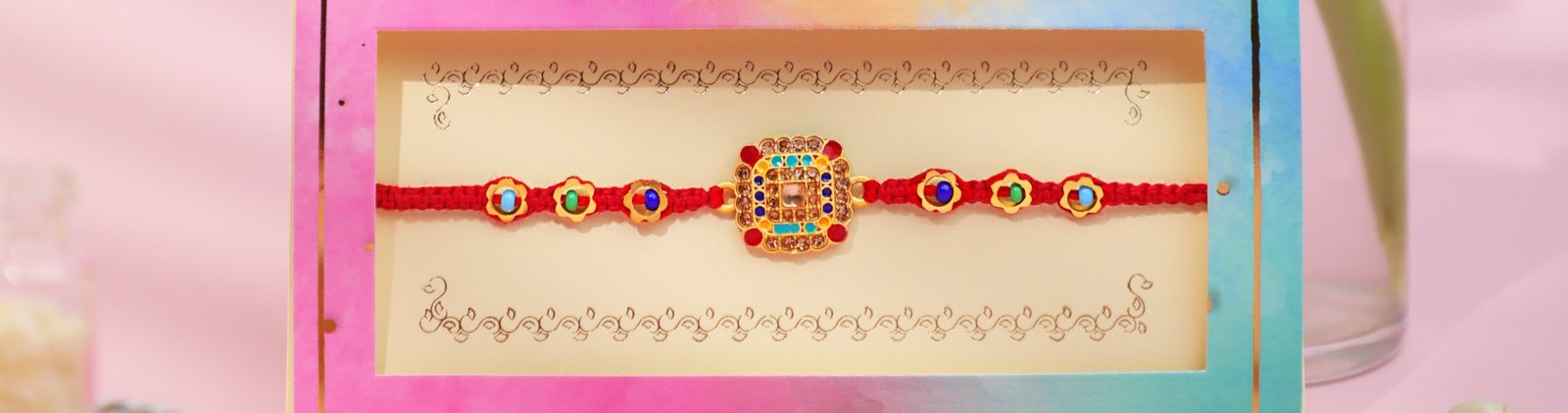 Meenakari Rakhi with multicolor beads and red thread in festive box – Kala Rakhi
